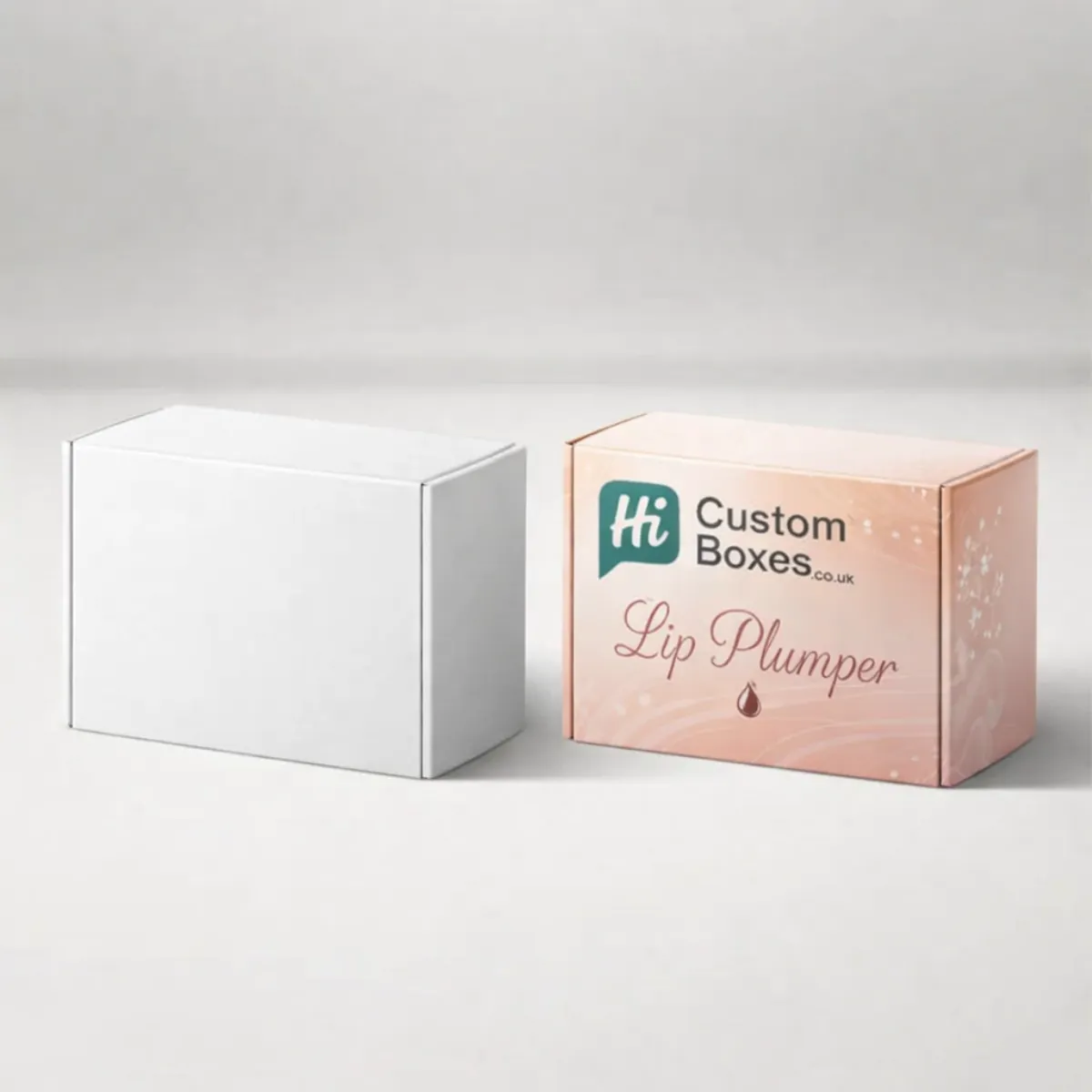 A side-by-side view of a blank white box and a custom pink lip plumper box. class=